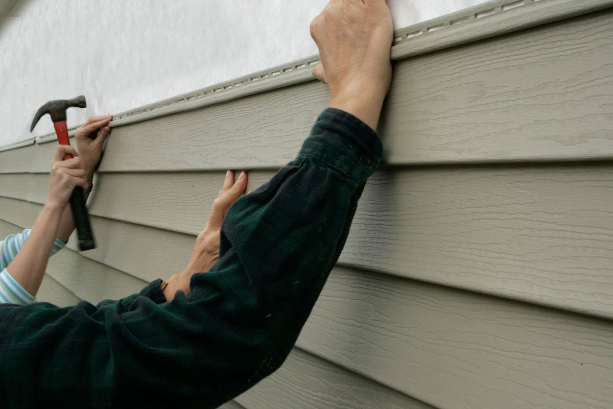 Vinyl siding installation in progress