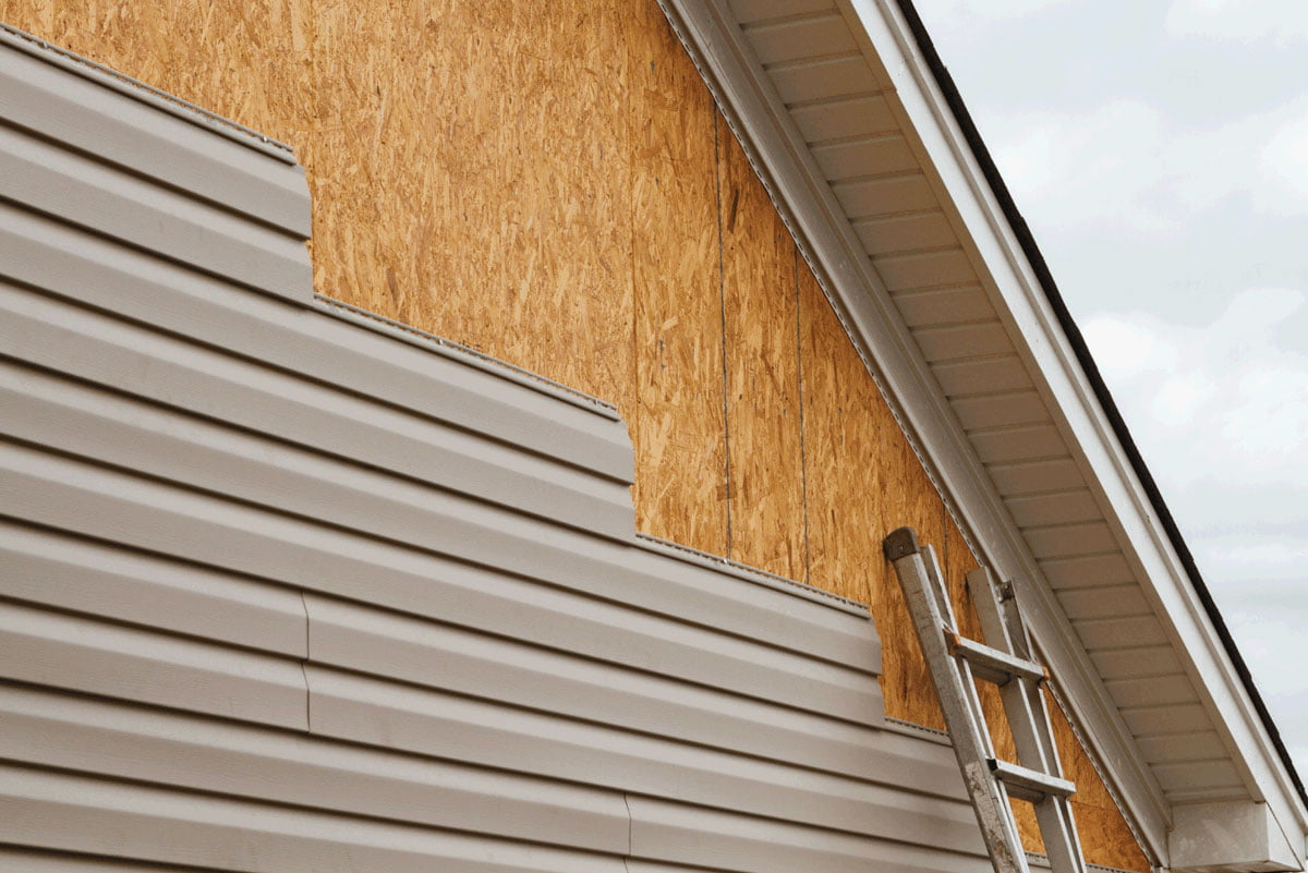 Vinyl siding installation in progress